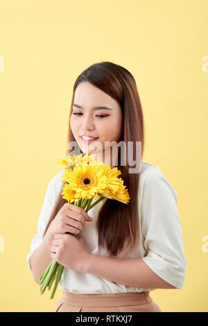 A Chinese Girl is Holding a Bunch of Fresh Flowers Stock Photo - Alamy