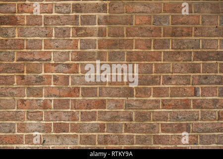 Simple old faded red bricks wall texture. Stock Photo