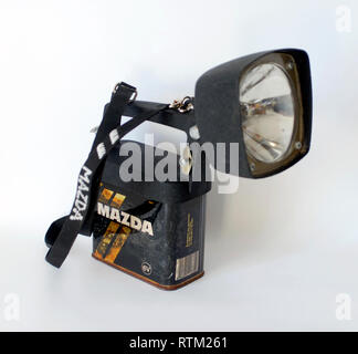 Old battery powered flashlight Mazda brand Stock Photo