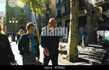 BARCELONA, SPAIN - NOV 12, 2017: Senior couple visiting Barcelona, walking on the Passeig del Born street on a sunny day  Stock Photo
