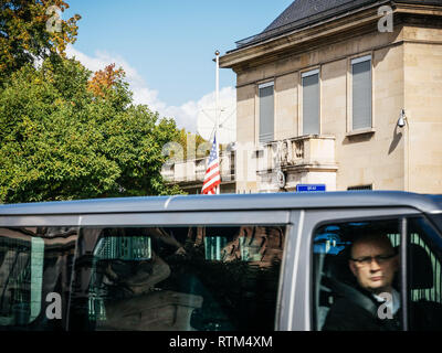 PARIS, FRANCE - OCT 3, 2017: US United States American Flag flying half-mast in court of the US Embassy after the 2017 Las Vegas Strip shooting in United States with about 60 fatalities and 527 injuries Stock Photo