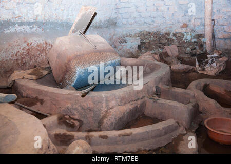Giant mill or mortar for the extraction of gold Stock Photo