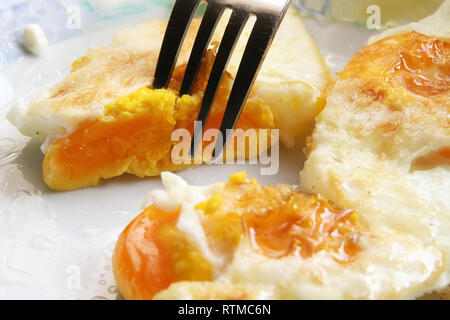 Fried eggs on a plate. Fresh made breakfast. Good healthy nutrition in the morning. Stock Photo