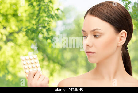 young woman with pills