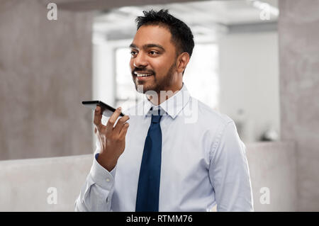 businessman using voice command on smartphone Stock Photo