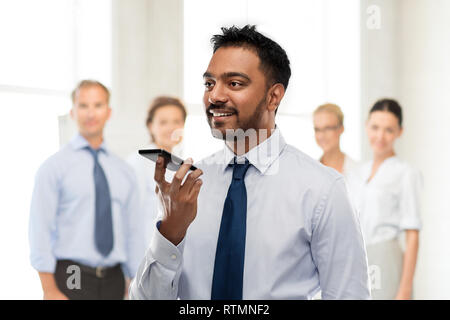 businessman using voice command on smartphone Stock Photo