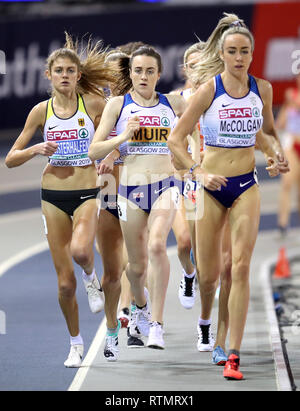 Great Britain's Laura Muir (centre) and Great Britain's Eilish McColgan (right) in the Women's 3000m final during day one of the European Indoor Athletics Championships at the Emirates Arena, Glasgow. Stock Photo