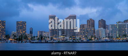 Waikiki skyline panorama from the Ala Moana beach park at night. Stock Photo