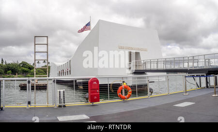 The USS Arizona Memorial on August 5, 2016 in Pearl Harbor, USA. Memorial marks resting place of sailors and Marines who died when the USS Arizona was Stock Photo