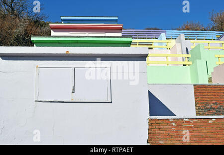 multi coloured beach huts in a line Stock Photo