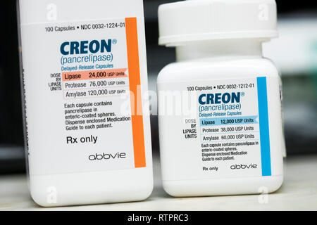 Bottles of Creon (pancrelipase) prescription pharmaceuticals, manufactured by Abbvie, photographed in a pharmacy. Stock Photo