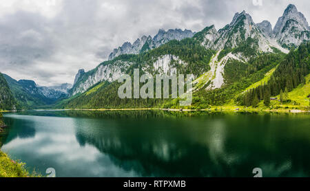 Beautiful view of idyllic colorful autumn scenery with Dachstein mountain summit reflecting in crystal clear Gosausee mountain lake in fall. Salzkamme Stock Photo