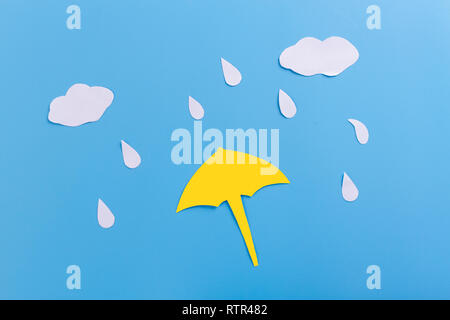 Rain drops falling onto umbella. paper cut Stock Photo