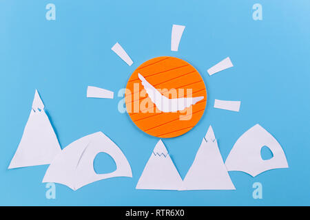 The tent stands on the background of high mountains. paper cut Stock Photo