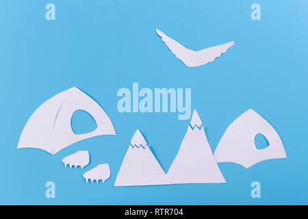 The tent stands on the background of high mountains. paper cut Stock Photo