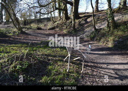 Abandoned supermarket trolley dumped at Pyrtle Springs, Princes Risborough, Buckinghamshire, UK - fly tipping in the Chilterns Stock Photo