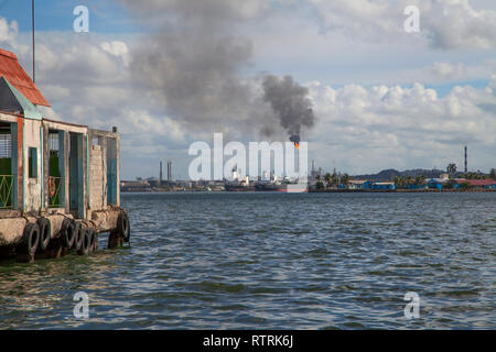 Havana, Cuba - 12 January 2013: Views of town center of squares and streets. A view through the harbor of the city on the shore. Stock Photo