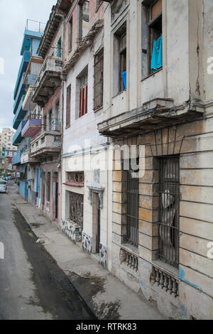 Havana, Cuba - 18 January 2013: Views of town center of squares and streets. Dilapidated facade of the city along the street. Stock Photo