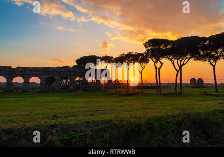 Rome (Italy) - The Parco degli Acquedotti at sunset, an archeological public park in Rome, part of the Appian Way Regional Park, with monumental ruins Stock Photo