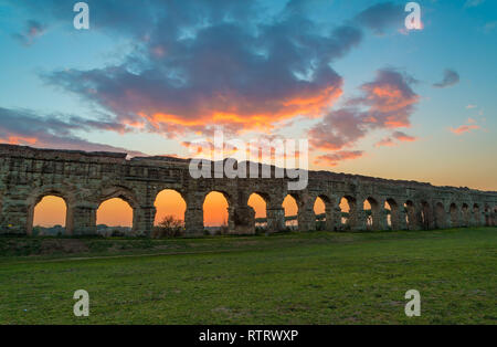 Rome (Italy) - The Parco degli Acquedotti at sunset, an archeological public park in Rome, part of the Appian Way Regional Park, with monumental ruins Stock Photo