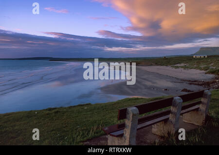 People on the beach and in the sea at Rosses Point with Ben Bulben in the background, County Sligo, Ireland Stock Photo