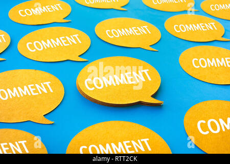 Comment concepts with yellow chat,speech bubble icons on blue color background.Talking and social media Stock Photo