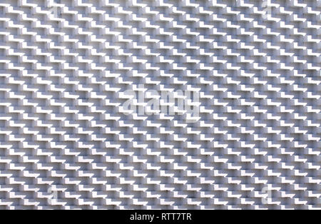 White brick wall in unusual pattern with bricks sticking out Stock Photo
