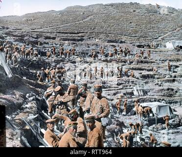 Colorized photo of Japanese soldiers resting in a hillside trench during the Russo-Japanese War, Port Arthur, China, 1905. (Photo by Burton Holmes) Stock Photo
