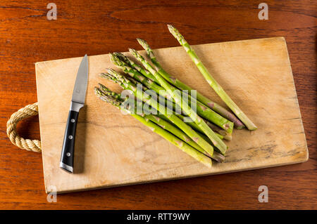 Asparagus tips with knife Stock Photo