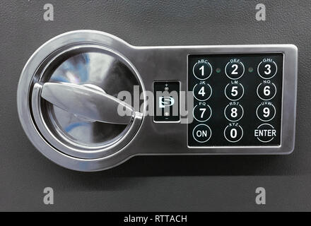 Code lock on the safe door on gray background Stock Photo