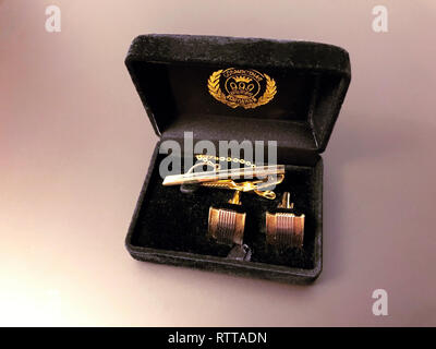 elegant male silver cufflinks in a black box on gray background Stock Photo