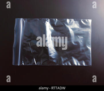 Transparent polyethylene package bag on dark background Stock Photo