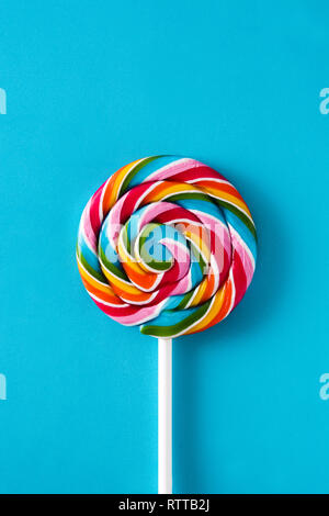 Colorful lollipop on blue background. Top view. Stock Photo