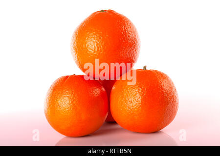 Four oranges stacked isolated on white. Stock Photo