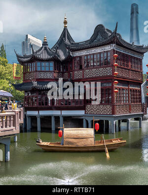 Huxinting Tea House aka Mid-lake Pavilion Tea house juxtaposed with Shanghai Tower and Bund Soho building in the background. Yu Garden, Old Shanghai. Stock Photo