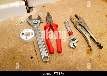 spanner,mole,grip, spanners, pliers,tools, plumbing, on floor,lined,up, Stock Photo