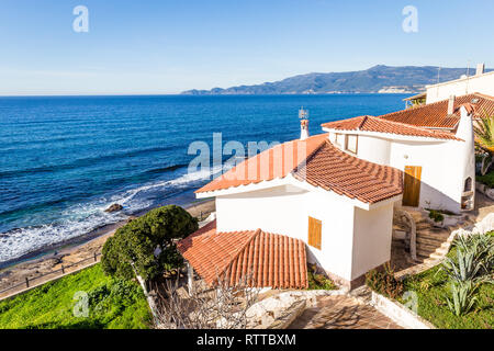 Porto Alabe, Sardinia island, Italy - December, 12, 2019: Beautiful white holiday house along the beach in Porto Alaba, Sardinia, Italy Stock Photo