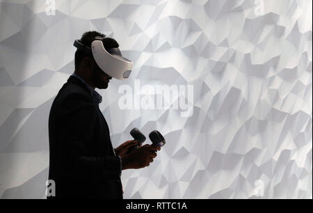 A man test Vive Htc virtual reality headset system at the Vive booth in the Mobile world congress in Barcelona. Stock Photo