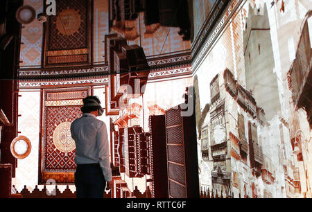 A man checks VR experience inside Saudi Telecom Company (STC) booth at the Mobile World Congress in Barcelona, Spain, February 26, Stock Photo