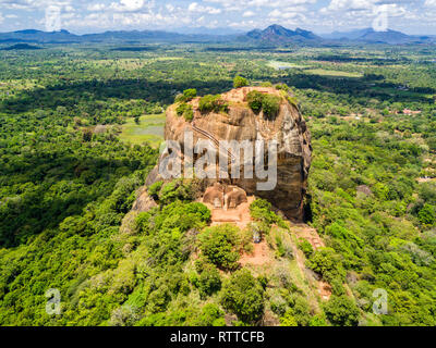 Sigiriya or the Lion Rock, an ancient fortress and a palace with gardens, pools, and terraces atop of granite rock in Dambulla, Sri Lanka. Aerial view. Stock Photo