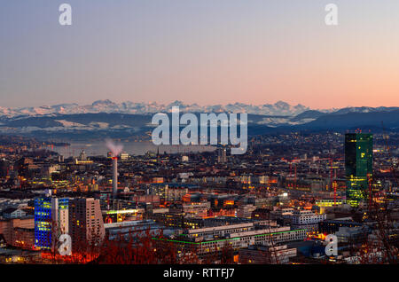 Zurich city overlook at sunset, alps in the background Stock Photo