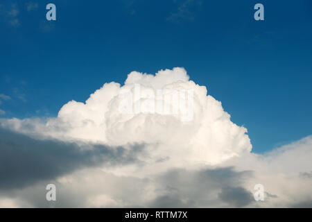 Big white cloud and blue sky background, copy space. Sky and clouds. Stock Photo