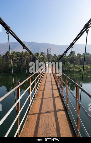 The Inchathotty Hanging Bridge crosses the Periyar River allowing access to the Inchathotty village. Thattekad, Kerala, India Stock Photo