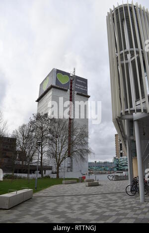 Grenfell Tower from the East. Local leisure centre and paved pedestrian precinct leads to the base of the tower of flats where fire broke out in 2017. Stock Photo