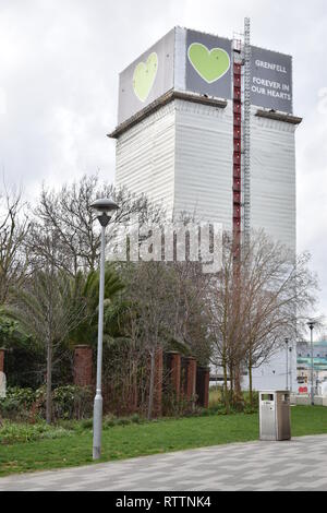 View of Grenfell Tower, with tarpaulin cover and scaffold. The major fire which was 14th June 2019, is subject of a Public Inquiry which continues. Stock Photo