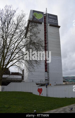 View of Grenfell Tower, with tarpaulin cover and scaffold. The major fire which was 14th June 2019, is subject of a Public Inquiry which continues. Stock Photo