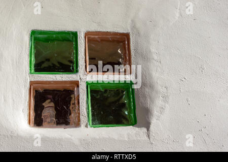 Glass window blocks in white washed wall Stock Photo