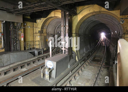 View north from Wapping Overground station platform showing the original entrance portal of Brunel's rail tunnel under the River Thames to Rotherhithe Stock Photo