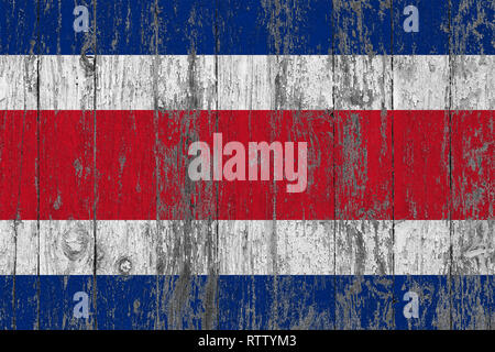 Flag of Costa Rica painted on worn out wooden texture background. Stock Photo