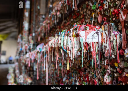 A close up of the Market Theatre Gum Wall in downtown Seattle The wall is a local landmark, lots of different coloured gum stuck to the wall. Stock Photo